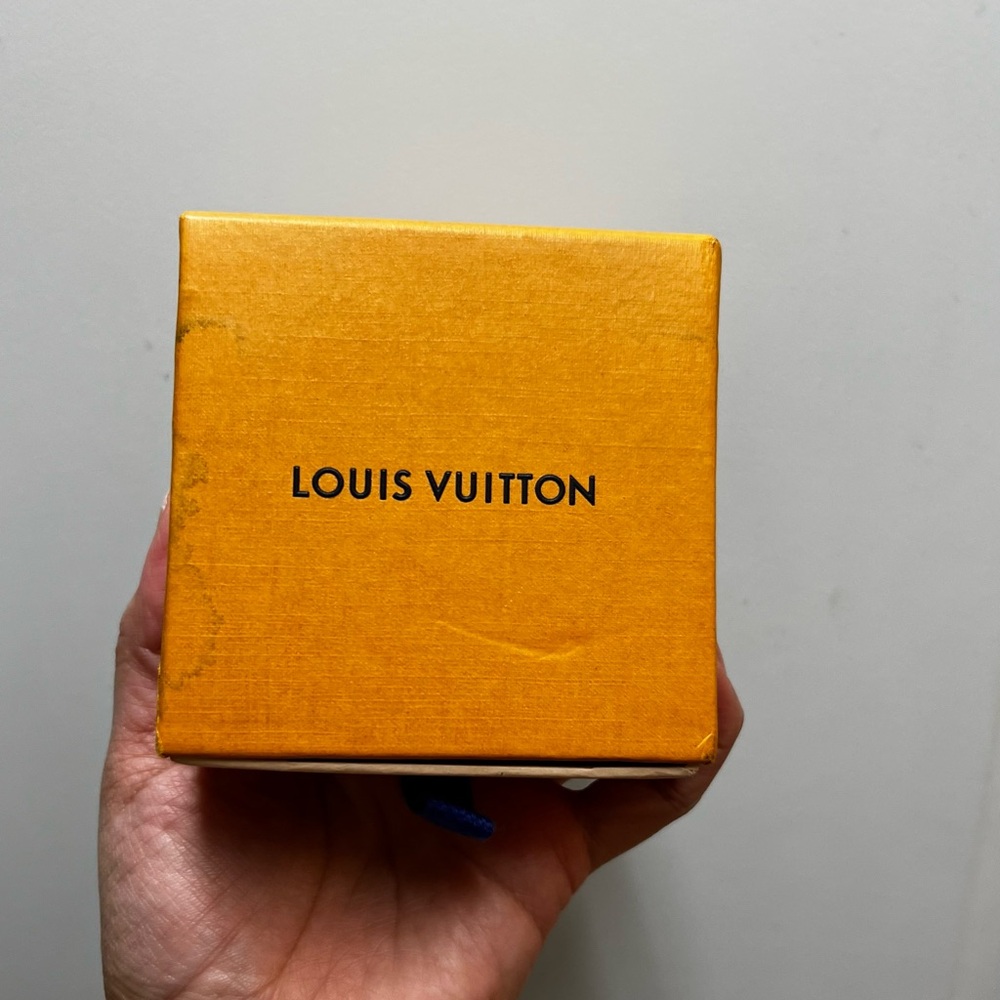 Louis Vuitton iconic orange box with blue pull tab